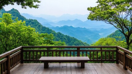 Fototapeta premium A serene wooden deck overlooks lush mountains, offering a peaceful retreat amidst vibrant greenery and expansive views of distant hills.