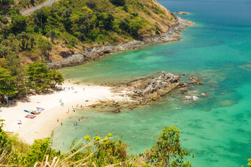 Beautiful aerial views of Yanui beach from Wind Turbine viewpoint with the tourists people from the high vantage point of cape Promthep day in Phuket, Thailand.