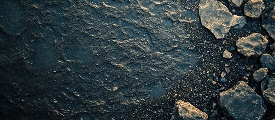 Dark gray gravel surface with textured details and ample negative space for customizable text or graphic overlays