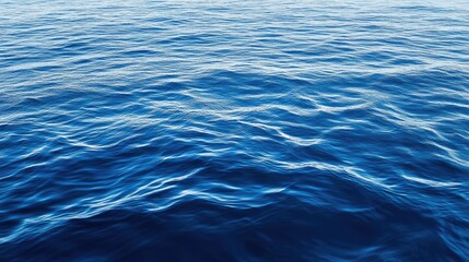 Fototapeta premium Aerial view of calm deep blue ocean waves creating a serene abstract water surface background in natural lighting