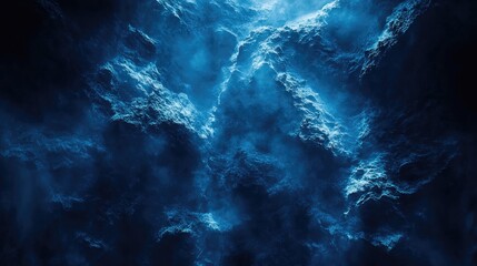 Obraz premium Abstract dark blue background with dynamic light reflections and textured wave patterns creating a mysterious underwater atmosphere