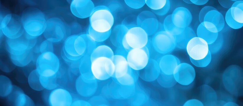 Defocused blue background with soft bokeh effect ideal for business themes and creative projects featuring ample copyspace for text.