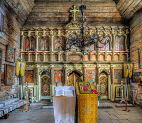 A wooden church, interior with an iconostasis