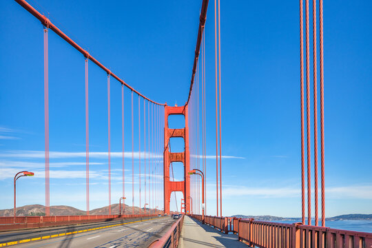 Iconic Golden Gate Bridge at sunset, showcasing its architectural beauty and vibrant red tones. A timeless symbol of San Francisco and a must-visit travel destination