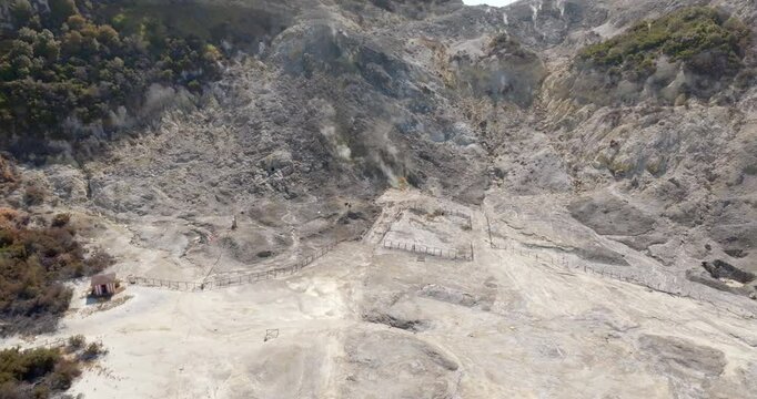 Aerial view of Solfatara in Pozzuoli, near Naples, Italy. It is a shallow volcanic crater part of the Phlegraean Fields volcanic area. It is a sleeping volcano. It has many fumaroles and mud pools.