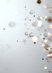 A blurry image of many small, shiny, round objects