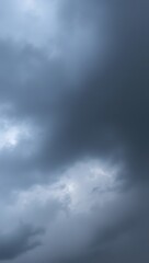 Fototapeta premium A dramatic sky filled with dark clouds, suggesting an impending storm.