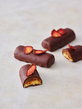 Delicious Modern Chocolate Bars With Fruit Toppings Showcasing Gourmet Flavor and Unique Presentation