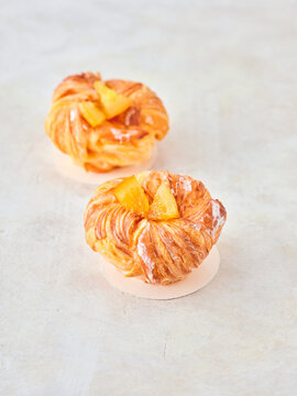 Delicious Modern Pastries With Fruity Topping Presented on a Minimalist Surface