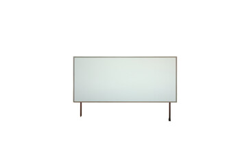 Fototapeta premium Blank billboard stands in a remote desert landscape surrounded by mountains under a clear blue sky