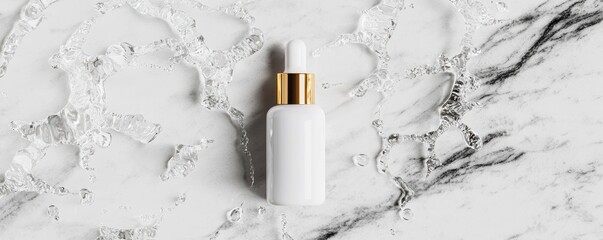 A sleek white serum bottle with a gold cap resting on a marble surface, surrounded by water droplets.