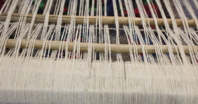 Old traditional weaving loom in a household where people learn to make wool cloth, woolen stockings and other traditional clothing items from Maramures.
