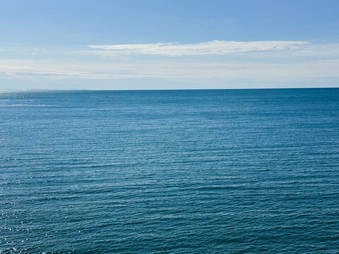 Blue wide sea and clear sky horizon.