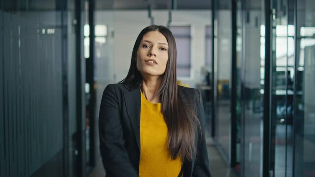 Professional woman removes duct tape from her mouth, transitioning from silence to empowerment in a modern office setting. Concept of self-expression, workplace rights, and empowerment