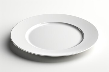 White plate ready for dining on a minimalist table setting with clean lines and soft lighting
