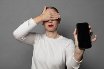 covering face with hand and putting other hand up front to stop camera, refusing photos or pictures