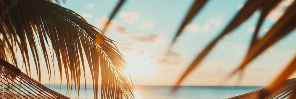Poster Golden sunset illuminates palm trees framing a hammock, creating a serene and inviting scene of tranquility at a tropical beach resort, promising ultimate relaxation and escape