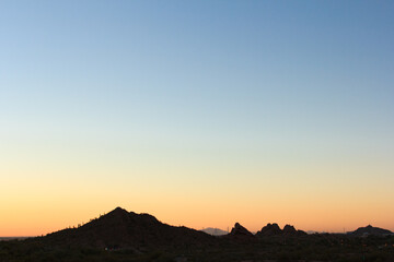 The sky is a beautiful shade of blue with a few clouds