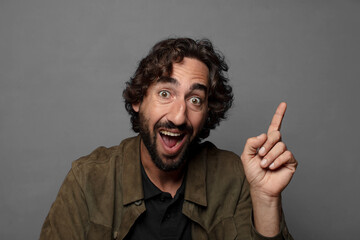 Fototapeta premium feeling like a happy and excited genius after realizing an idea, cheerfully raising finger, eureka!