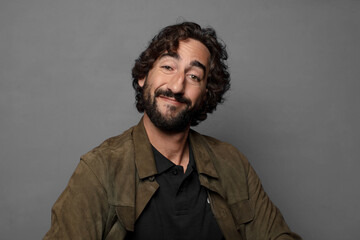 smiling happily with a hands on hip and confident, proud and friendly attitude