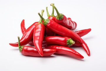 Fresh red chilies stacked together showcasing vibrant colors and natural shape in a bright setting