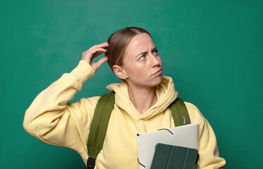 feeling puzzled and confused, scratching head and looking to the side