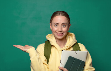smiling, feeling confident, successful and happy, showing concept or idea on copy space on the side