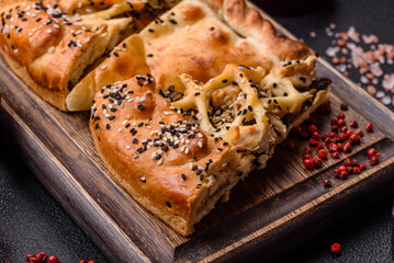 French quiche with chicken or salmon, cheese, salt, spices and herbs