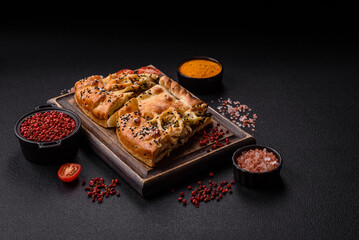 French quiche with chicken or salmon, cheese, salt, spices and herbs
