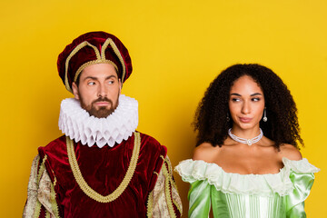 Elegant Couple in Historical Costumes Posing Against a Yellow Backdrop, Combining Classic Aristocratic Style With Modern Trends