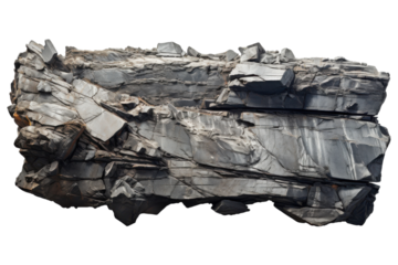 Natural formation of dark rock showcasing unique textures and patterns in a well-lit setting