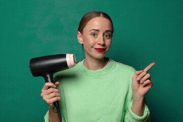 young blonde woman with a hair dryer