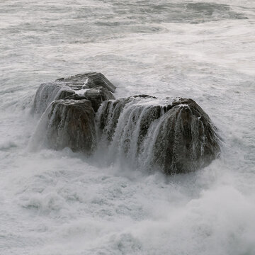 the aftermath of waves on the rocks