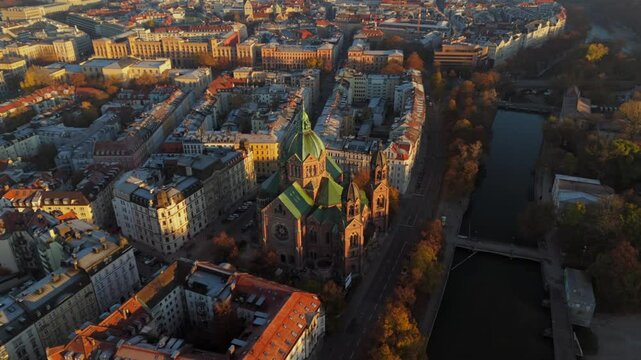 Church of St. Lukas, St. Lukes on banks of river Isar, called Lukaskirche for short, is one of Munichs most impressive church buildings Bavaria, Germany aerial view in fall. Lukaskirche Luftaufnahme. 