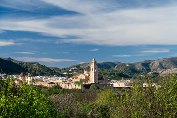 Naklejka premium Landscape with a village on background, Simat de la Valldigna, Comunidad Valenciana (Spain).