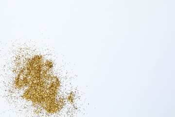Beautiful golden confetti on a white background