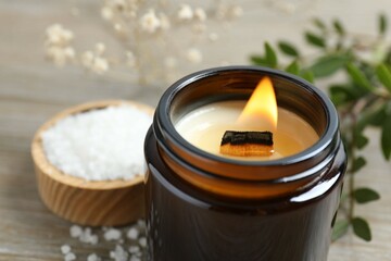Handmade scented candle in a glass. Soy wax candle with a wooden wick