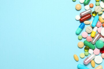 Various pills on color background