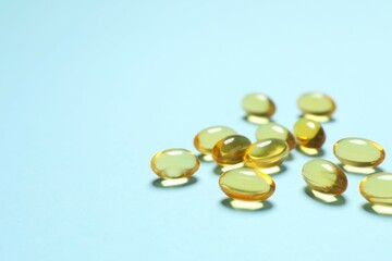 Capsule of omega 3, 6, 9 fish oil, vitamin, food supplement on color background 