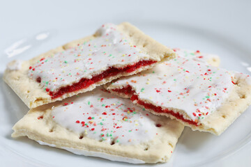 Strawberry Toaster Pastries with frosting and sugar sprinkles ready to eat