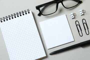 Workplace with notebook, pen, stationery, cup of coffee, top view 