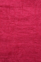 Pink fabric background, top view