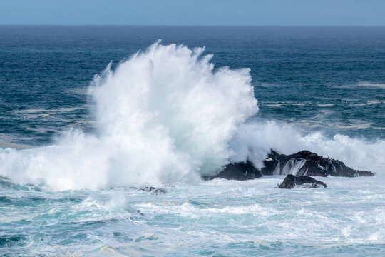 big wave crashing on the rocks