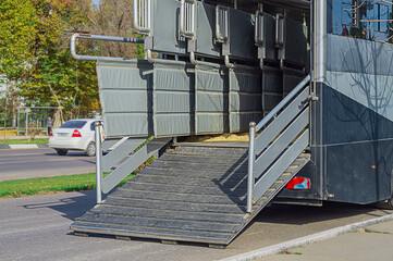 Photo of the back of transport trailer, a bus for transporting expensive thoroughbred horses to the...