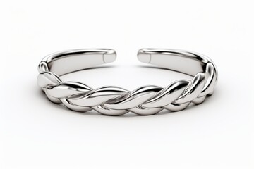 Naklejka premium Elegant silver braided cuff bracelet displayed on a simple white background showcasing modern jewelry design and craftsmanship
