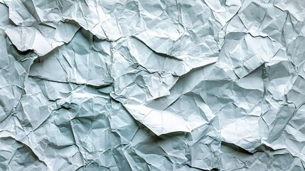 Fototapeta premium Crumpled light blue paper texture background.