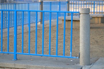 painted blue metal fence in park