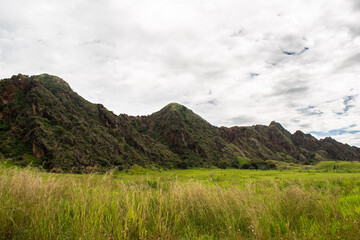 A remarkable view of a synclinal mountain formation in Tesalia, Huila, Colombia, featuring the intricate geological folding of rock layers. This image is perfect for geological studies, educational