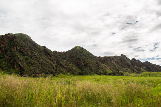 A remarkable view of a synclinal mountain formation in Tesalia, Huila, Colombia, featuring the intricate geological folding of rock layers. This image is perfect for geological studies, educational