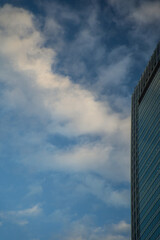 Fototapeta premium City. Skyscraper against blue sky. Cloudy weather. Tall building